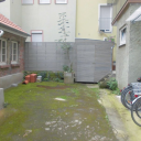 M&uuml;lleinhausung aus Stahl mit Holzverkleidung